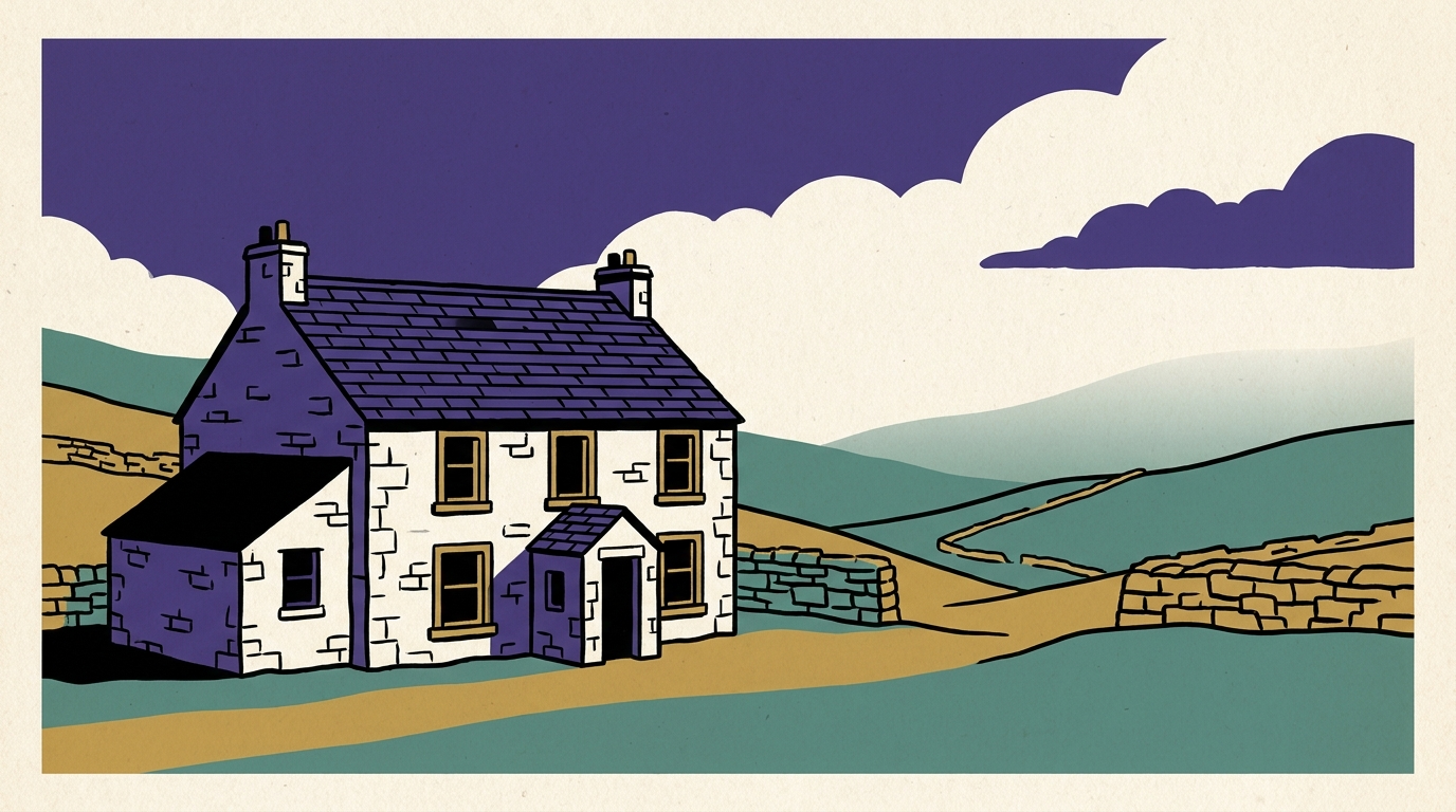 A traditional stone holiday cottage in the British countryside under a cloudy sky with no lights on inside.